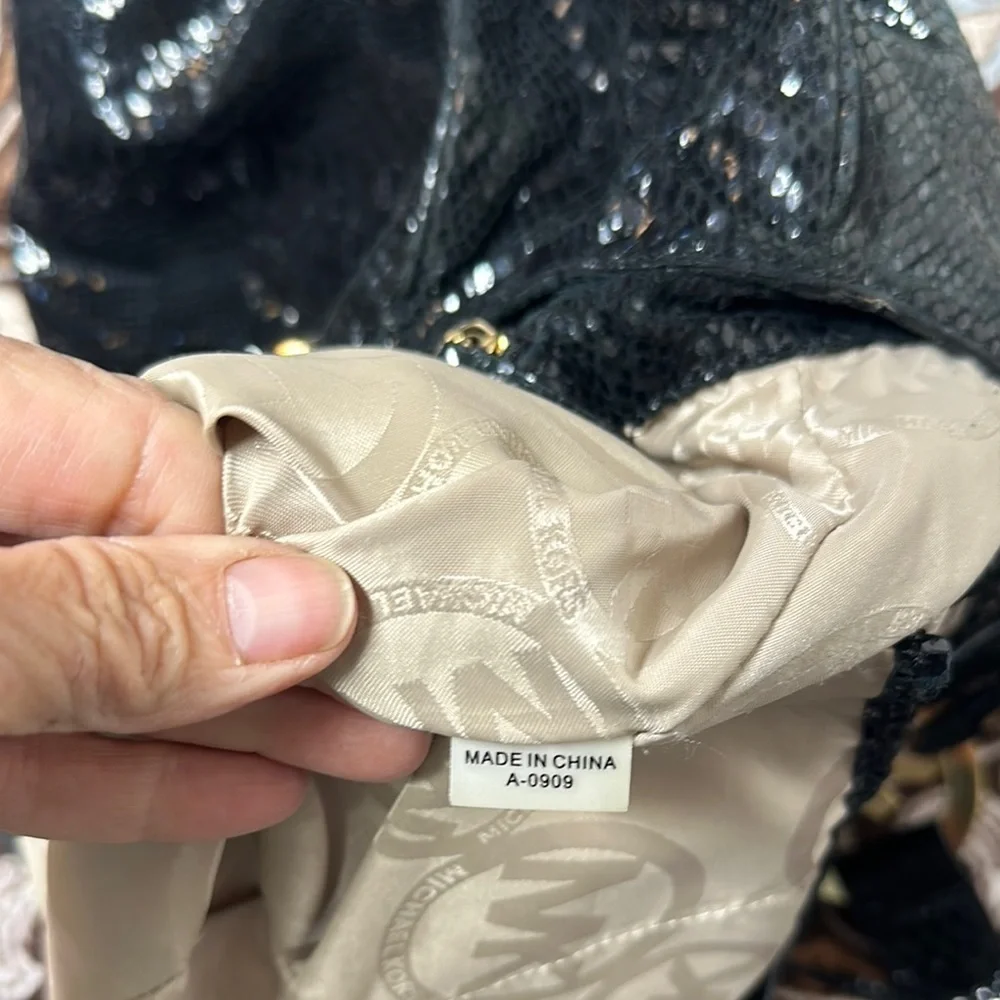 Michael Kors Black Hobo Bag with Gold Emblem
